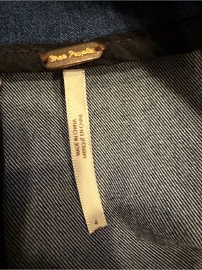 Free People denim blue jean jacket with gold hardware